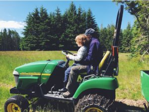 Children on tractor with Cynthia Bourgeault